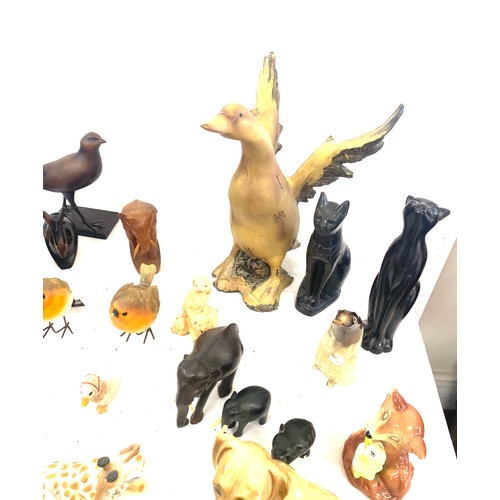 737 - Large selection of dog figures includes Carved wooden, plastic, egyptian cats etc