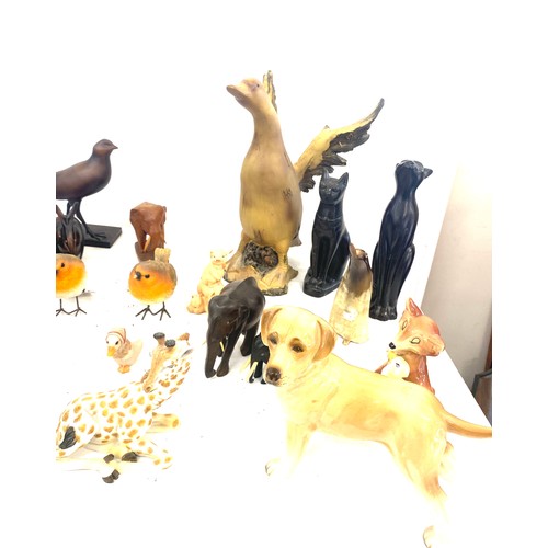 737 - Large selection of dog figures includes Carved wooden, plastic, egyptian cats etc