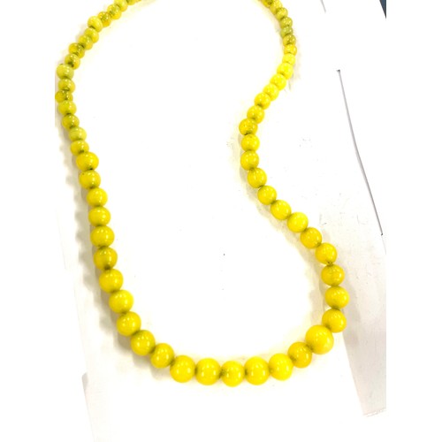 511 - Set of Vintage yellow glass beads with silver clasp, length approx 22 inches long