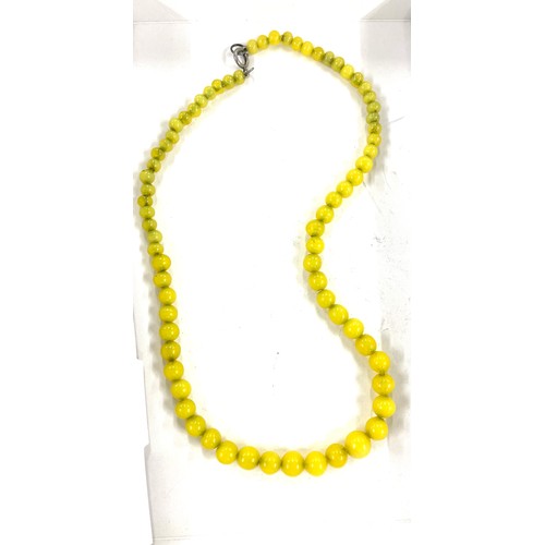 511 - Set of Vintage yellow glass beads with silver clasp, length approx 22 inches long