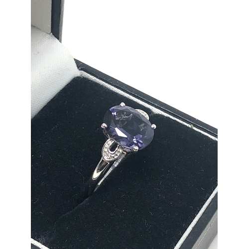 78 - 9ct white gold diamond & tanzanite ring weight 2g