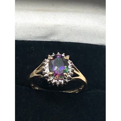 79 - 9ct  gold diamond & mystic topaz ring weight 2.5g