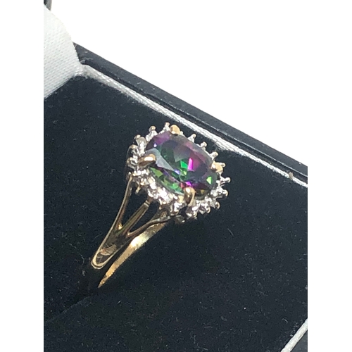 79 - 9ct  gold diamond & mystic topaz ring weight 2.5g