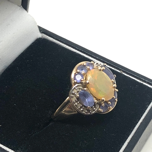 82 - 9ct gold tanzanite diamond & fire opal ring weight 3g