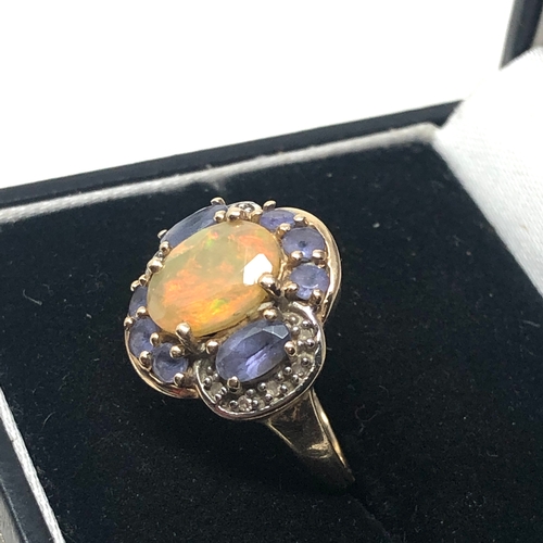 82 - 9ct gold tanzanite diamond & fire opal ring weight 3g