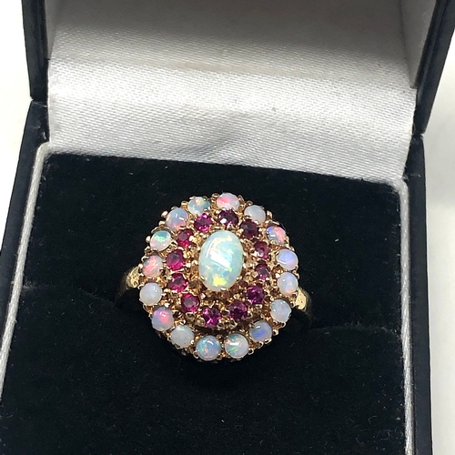 87 - 9ct gold opal & ruby ring weight 4.5g