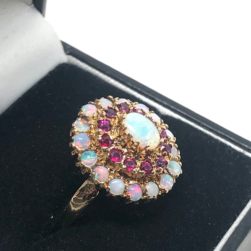 87 - 9ct gold opal & ruby ring weight 4.5g