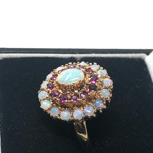 87 - 9ct gold opal & ruby ring weight 4.5g