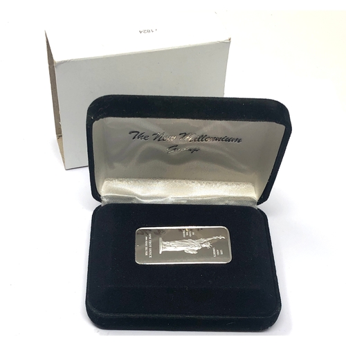 3 - Boxed the new millennium group official 1oz 999.silver ingot with coa