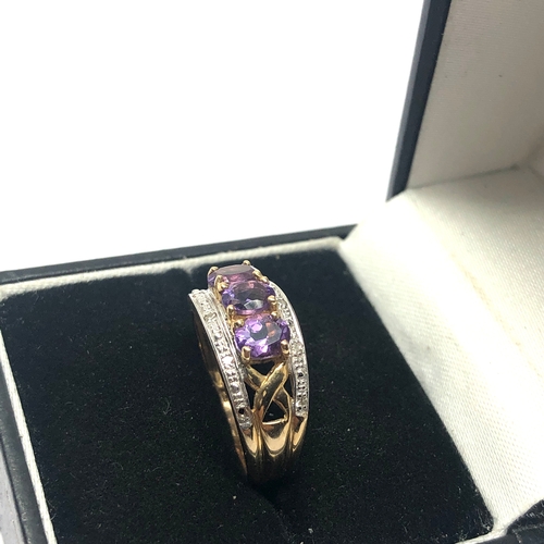 105 - 9ct gold diamond & amethyst ring weight 3.5g