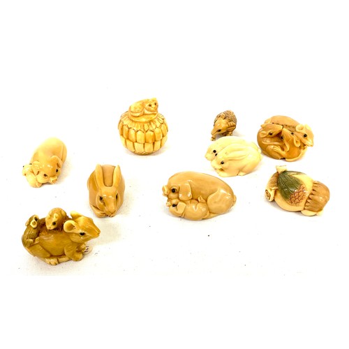 40 - Selection of 8 signed Tagua nut netsukes to include Mouse, Rabbits, pigs etc