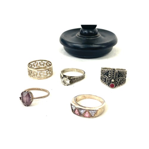 506 - Selection of 5 silver hallmarked rings and stand