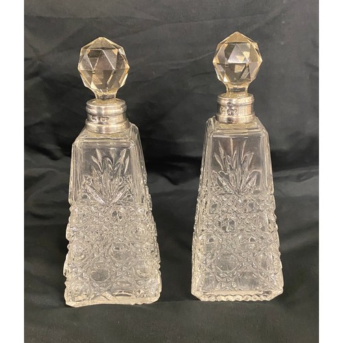 499 - Matching pair of 1912 silver rimmed scent bottles