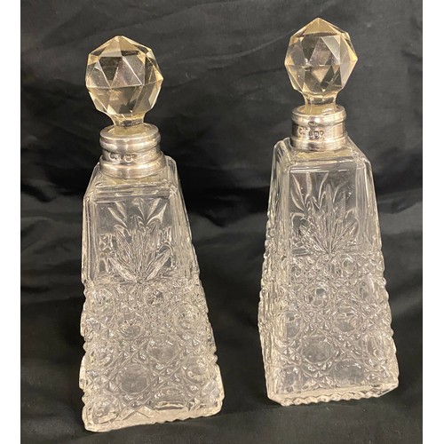 499 - Matching pair of 1912 silver rimmed scent bottles