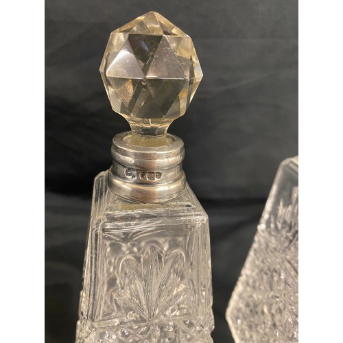 499 - Matching pair of 1912 silver rimmed scent bottles