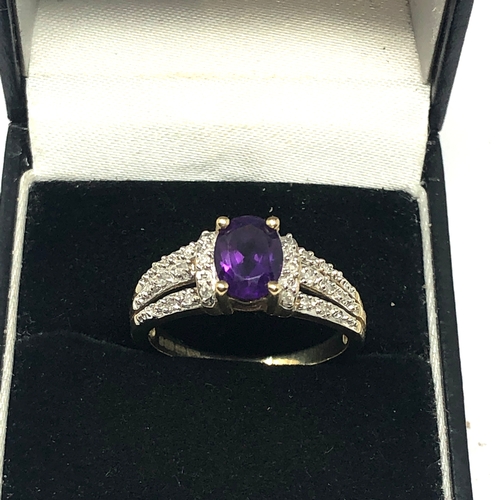 63 - 9ct gold diamond & amethyst ring set with 0.15ct diamonds weight 3.5g