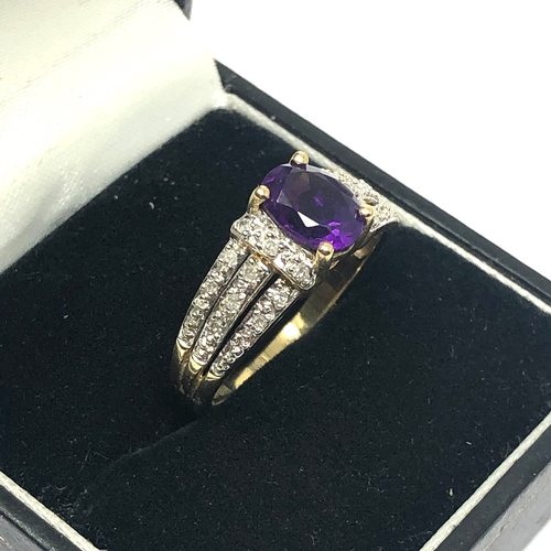 63 - 9ct gold diamond & amethyst ring set with 0.15ct diamonds weight 3.5g