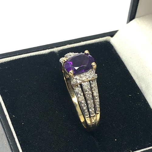 63 - 9ct gold diamond & amethyst ring set with 0.15ct diamonds weight 3.5g