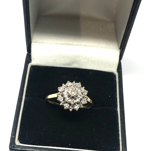 64 - 9ct gold diamond cluster ring weight 2.6g