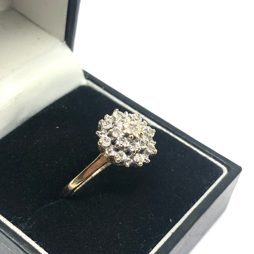 64 - 9ct gold diamond cluster ring weight 2.6g