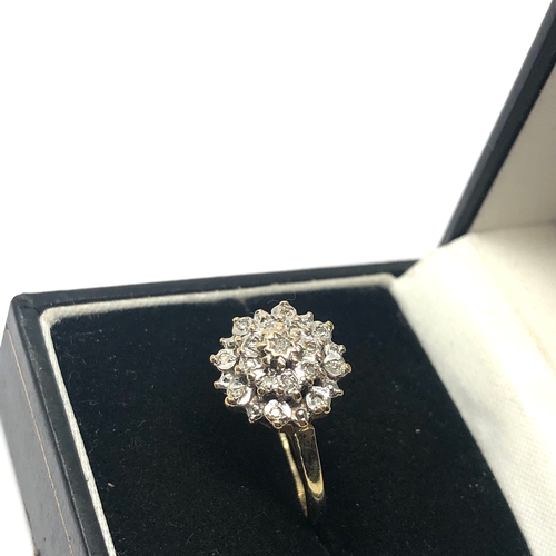 64 - 9ct gold diamond cluster ring weight 2.6g