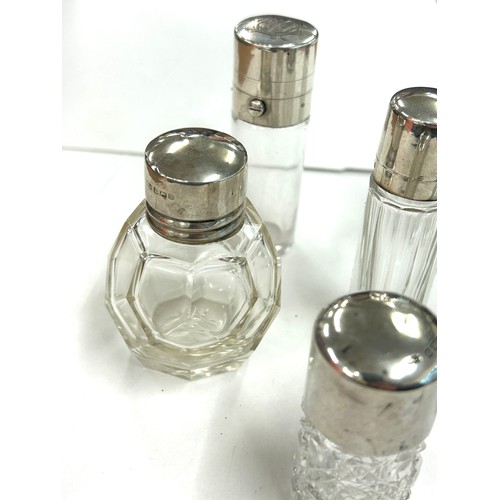 486 - Six antique silver topped scent/perfume bottles