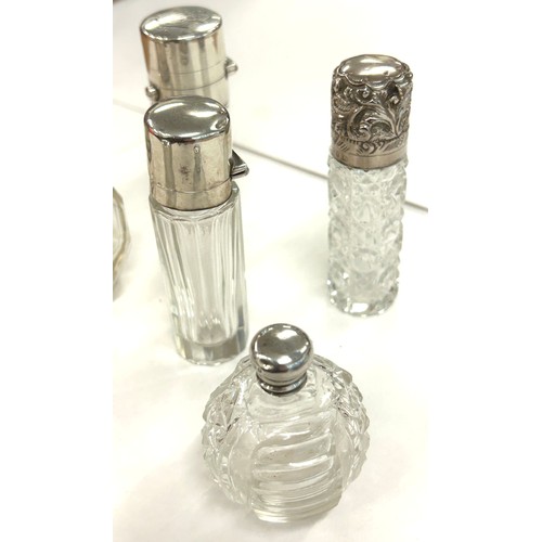 486 - Six antique silver topped scent/perfume bottles