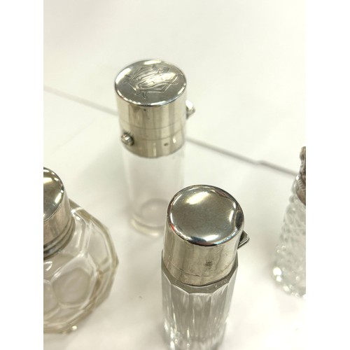 486 - Six antique silver topped scent/perfume bottles