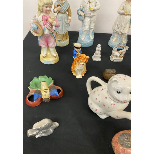 44 - Large selection of assorted figures includes animal figures, cat tea pot etc