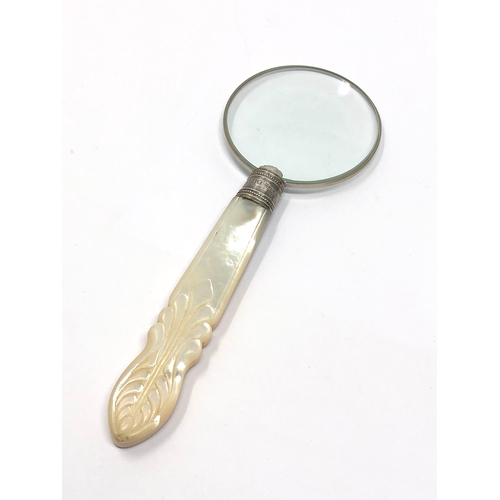 19 - Antique silver mounted & mother of pearl handle magnifying glass measures approx 14cm long