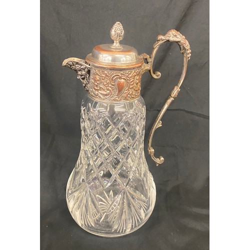 107 - A lead crystal decanter with silver plated lid measures approx height 11.5 inches