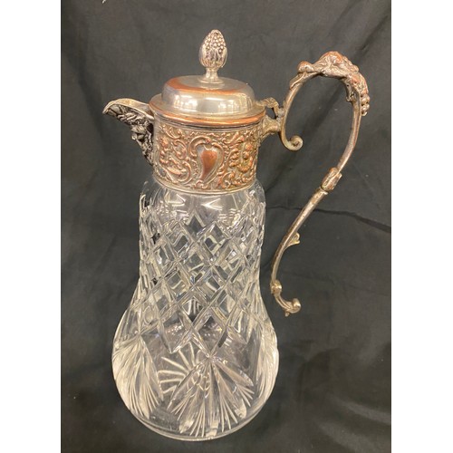 107 - A lead crystal decanter with silver plated lid measures approx height 11.5 inches