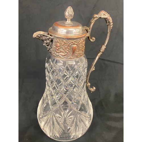 107 - A lead crystal decanter with silver plated lid measures approx height 11.5 inches