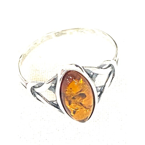 513 - Selection of amber jewellery includes Necklace, Silver and amber ring and a insect insert ring