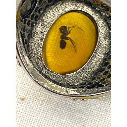 513 - Selection of amber jewellery includes Necklace, Silver and amber ring and a insect insert ring