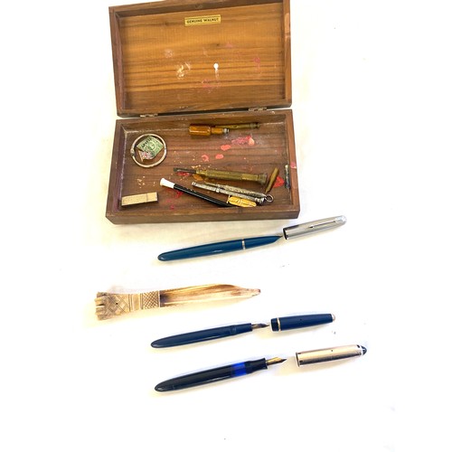 489 - Box containing fountain pens , white metal pencils and a treen bottle pencil