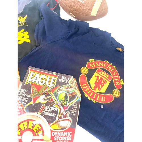 184 - Liverpool and Manchester United t shirts, American football and 2 vintage Eagle comics