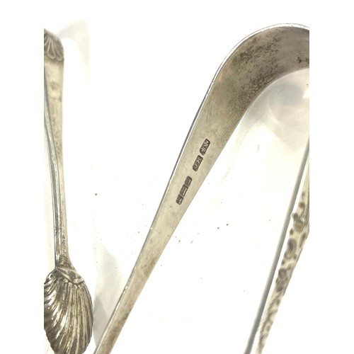 494 - 2 Pairs of Victorian Silver sugar tongs and a silver teaspoon All Sheffield 1900, 1905, 1919 hallmar... 