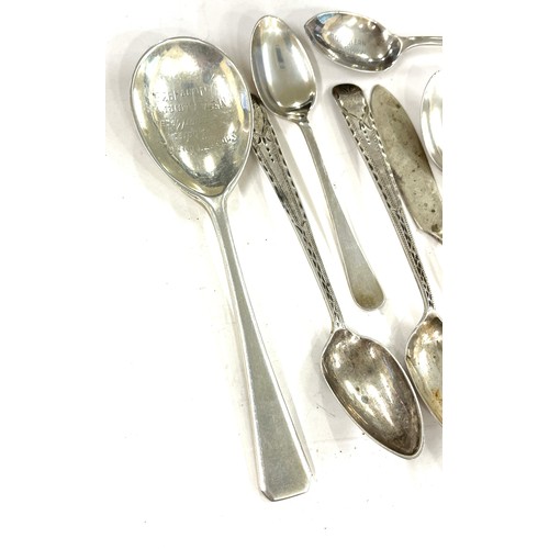 631 - 11 Silver spoons, 1 Butter knife, Edinburgh, Newcastle, Sheffield marks, total weight approximately ... 