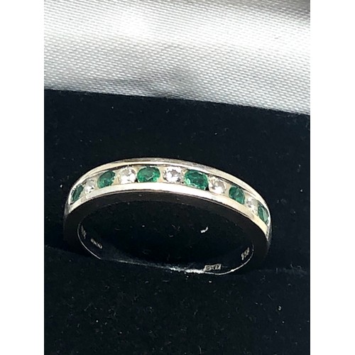 163 - 18ct white gold emerald & diamond half-eternity ring (3.8g)