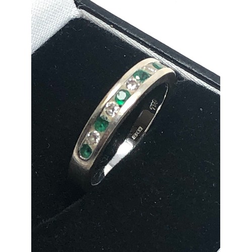 163 - 18ct white gold emerald & diamond half-eternity ring (3.8g)