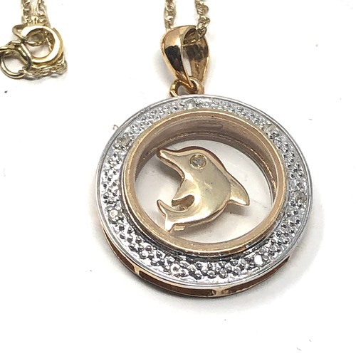 146 - 9ct gold diamond detail dolphin spinning pendant necklace (3.1g)