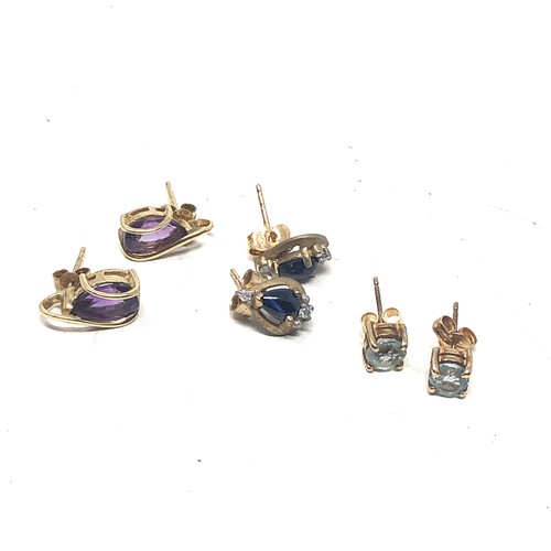 138 - 3 x 9ct gold earrings including topaz, sapphire and amethyst (4.3g)