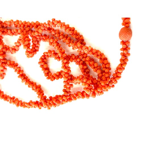 633 - Antique Georgian craved coral necklace. Weighs approx 54 grams. Measures approx 126 cm in length