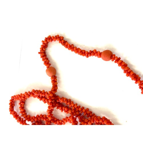 633 - Antique Georgian craved coral necklace. Weighs approx 54 grams. Measures approx 126 cm in length