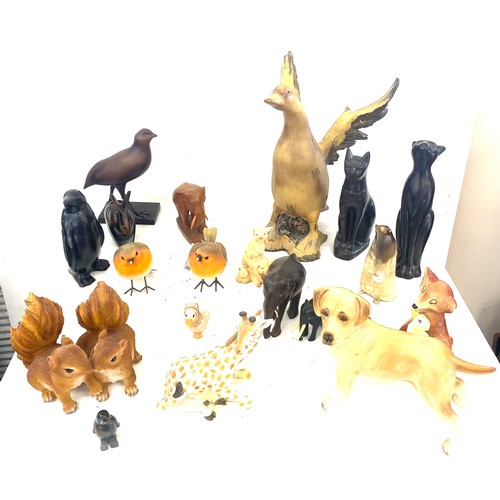 160 - Large selection of dog figures includes Carved wooden, plastic, egyptian cats etc