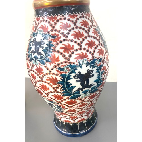 35 - A pair of hand painted oriental vases marks to base measures approx 14 inches high