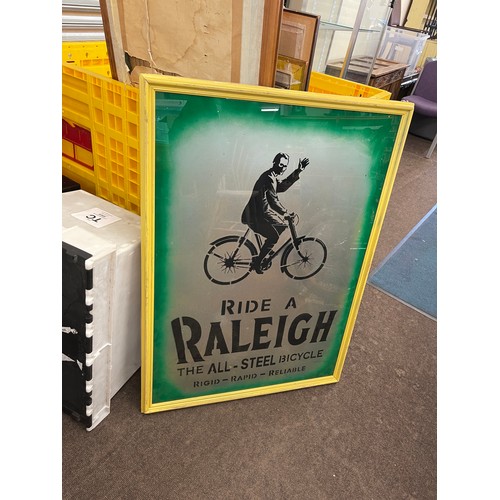 238 - Framed advertising Ride a Raleigh the all steel bicycle sign measures approx 39 inches by 28 inches