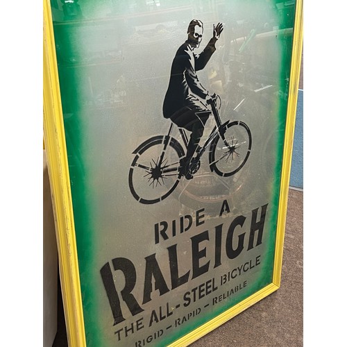 238 - Framed advertising Ride a Raleigh the all steel bicycle sign measures approx 39 inches by 28 inches