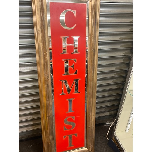 180 - Framed advertising Chemist mirror frame measures approx 55 inches by 18 inches